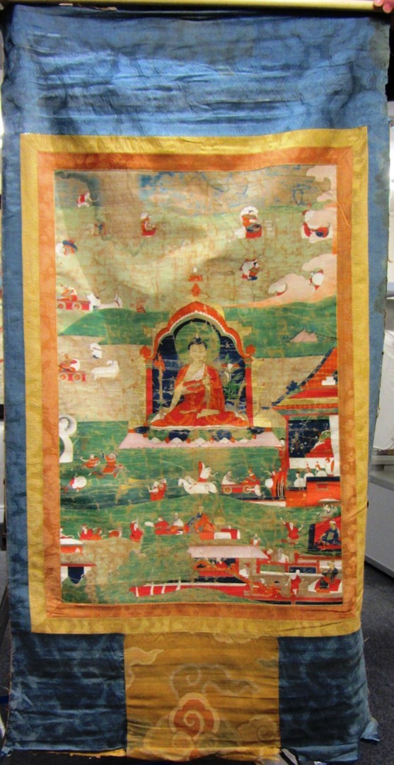 Appraisal: A Tibetan thangka painting on silk depicting Buddha seated with