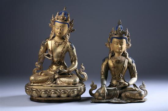 Appraisal: TWO NEPALESE BRONZE FIGURES OF VAJRASATTVA One seated on lotus