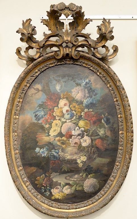 Appraisal: Large oval oil on canvas still life of flowers in