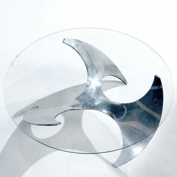 Appraisal: MODERN Coffee table on blade-shaped steel base with glass top