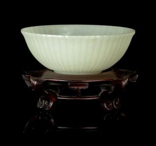 Appraisal: A Near-White Jade Chrysanthemum Bowl carved to depict a row