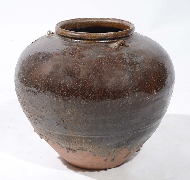 Appraisal: A LARGE BURMESE OVOID STORAGE JAR with treacle glaze decoration