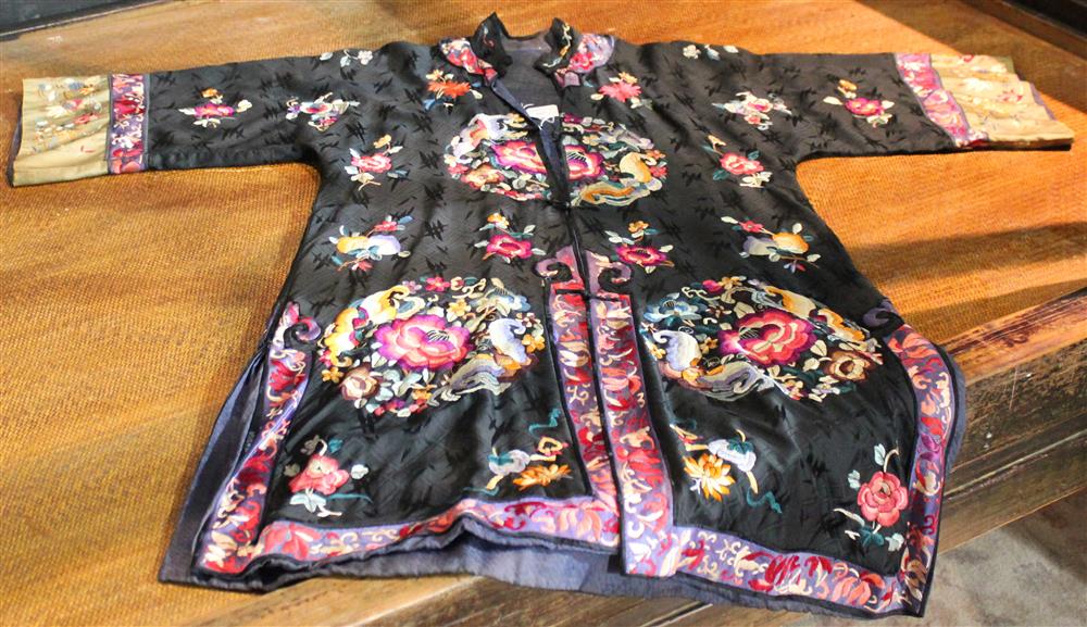 Appraisal: CHINESE EMBROIDERED WOMAN'S ROBE small size in black silk with