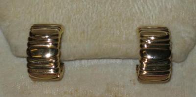 Appraisal: A PAIR OF CARTIER CT GOLD EARRINGS of moulded sleeper