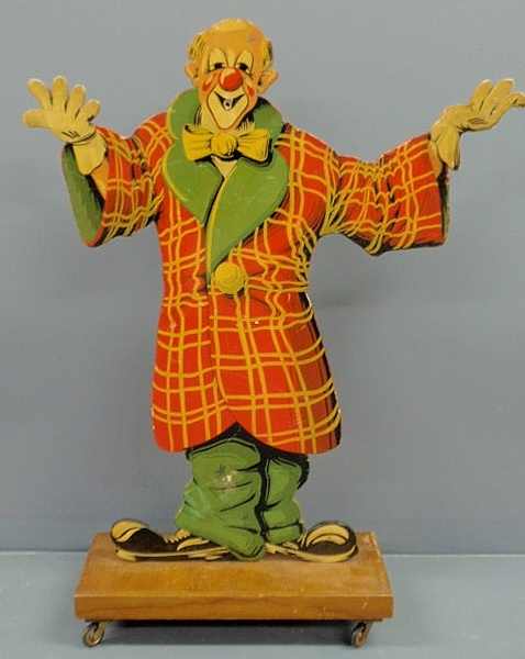 Appraisal: Carved painted figure of a clown and mounted on a