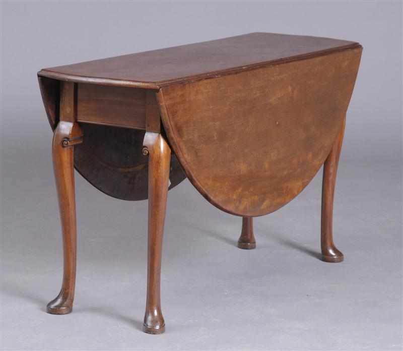 Appraisal: GEORGE II CARVED MAHOGANY DROP-LEAF TABLE With bowed ends and