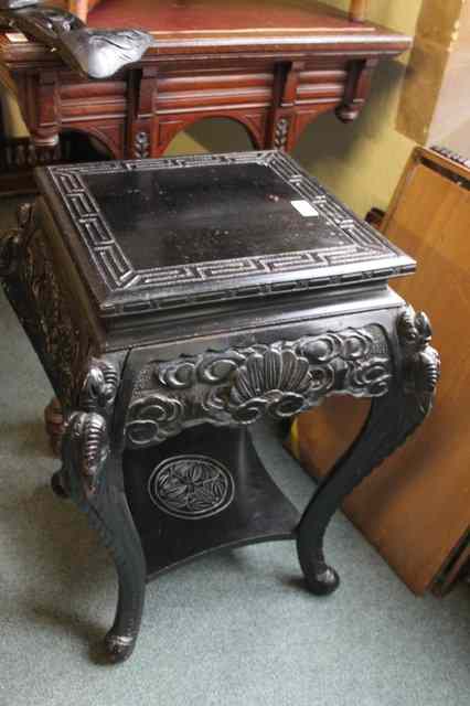 Appraisal: AN EBONISED SQUARE CHINESE STYLE URN STAND with shaped supports