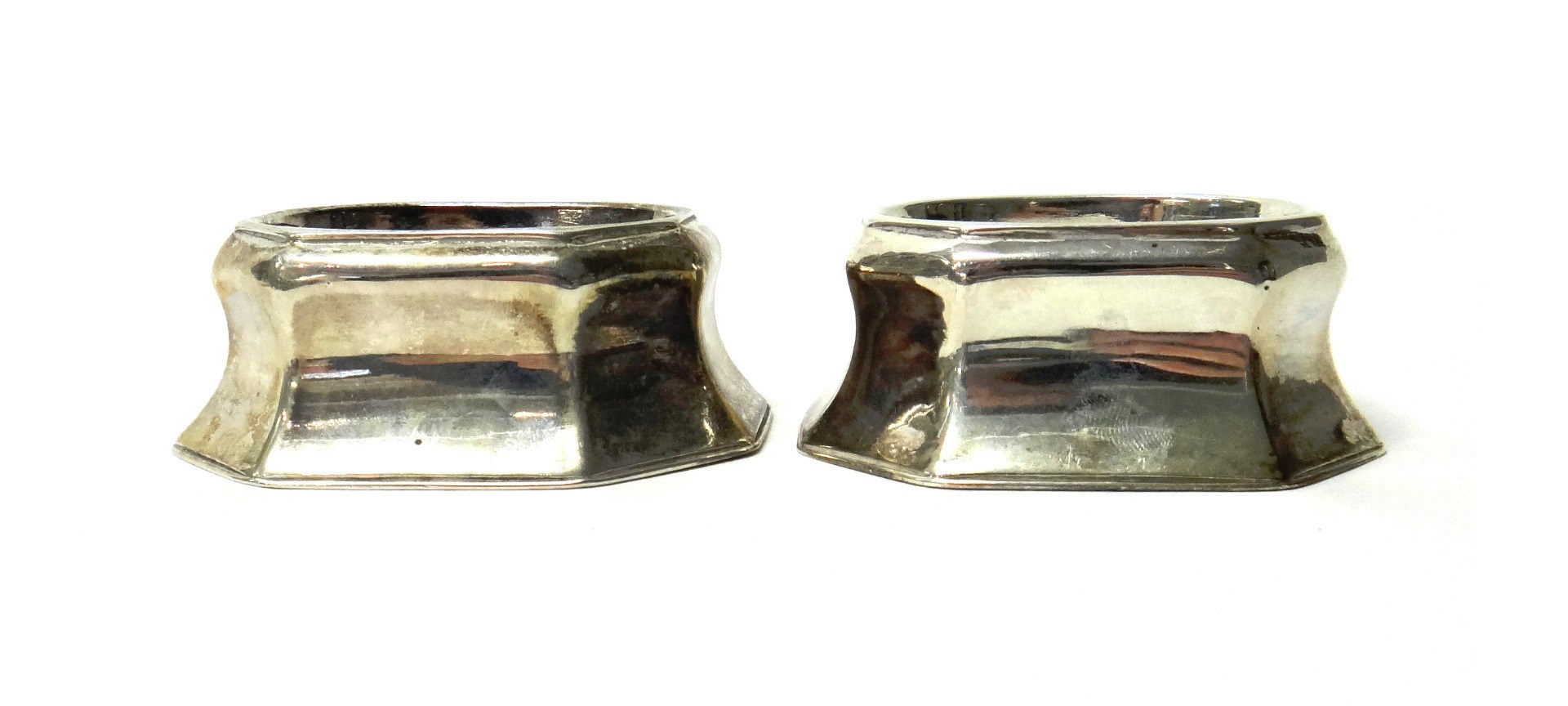 Appraisal: A pair of George I silver cut cornered rectangular trencher