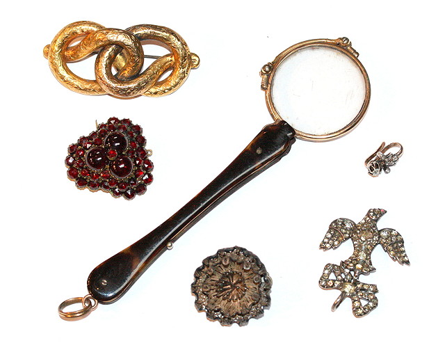 Appraisal: A COLLECTION TO INCLUDE a Victorian garnet set brooch a