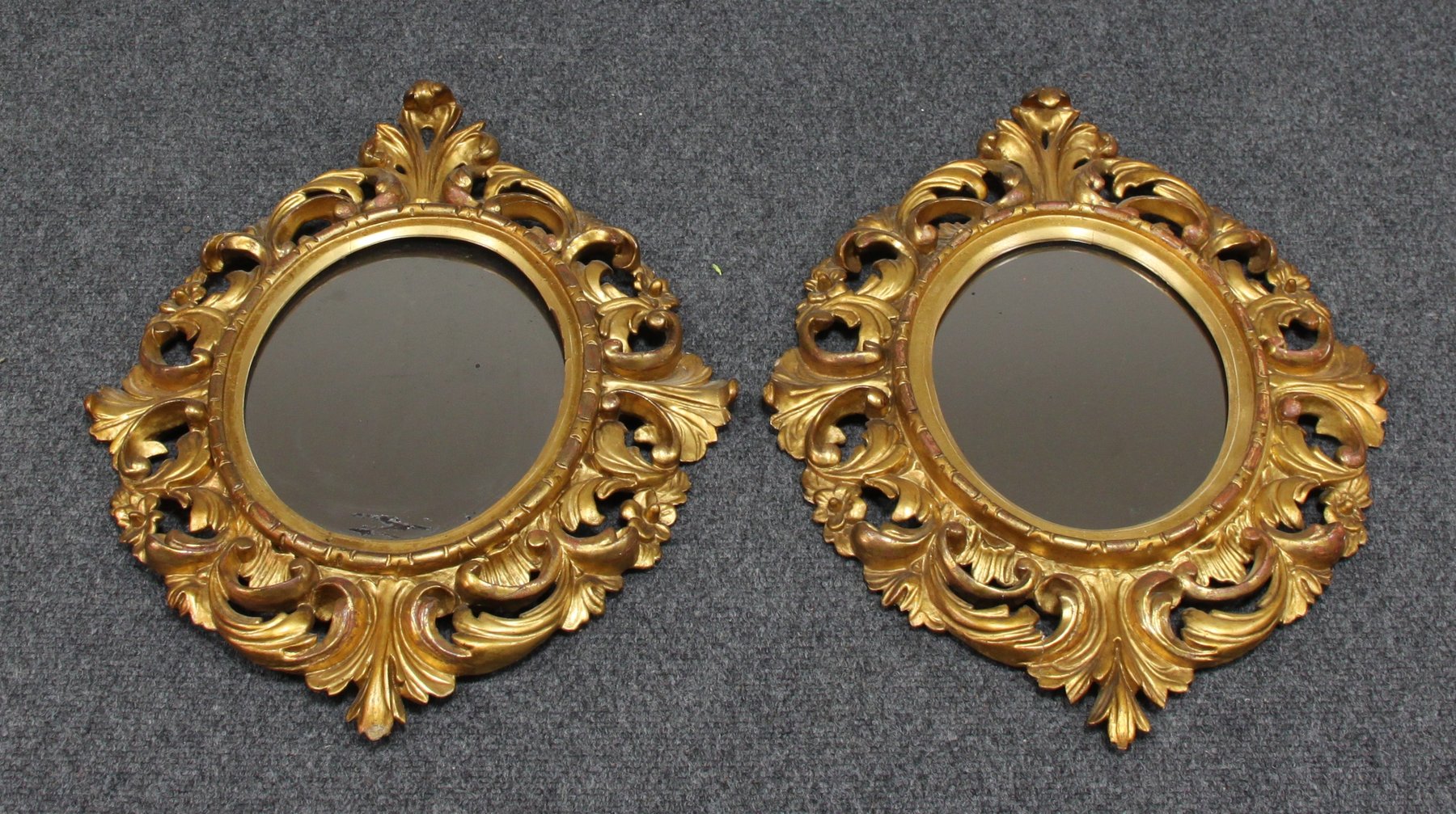 Appraisal: A pair of carved wooden and gilt Florentine wall mirrors