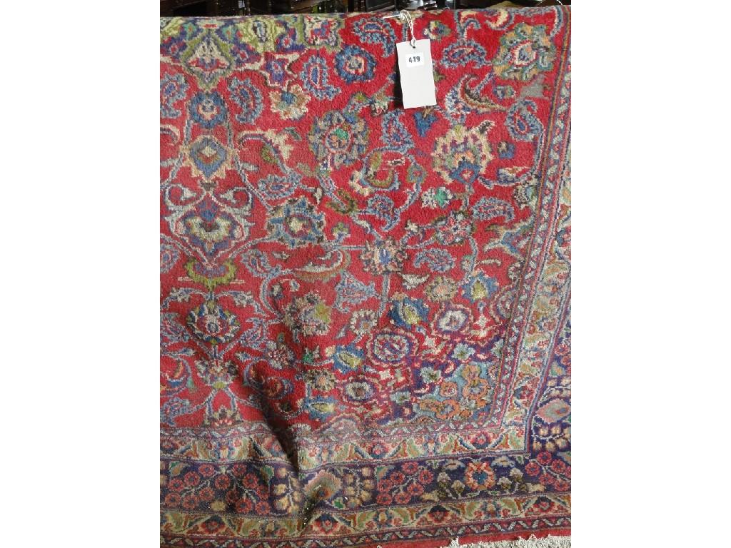 Appraisal: An Indian style carpet with a central floral medallion with