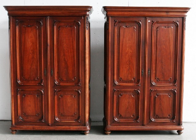 Appraisal: A pair of French provincial Louis XV style walnut armoires