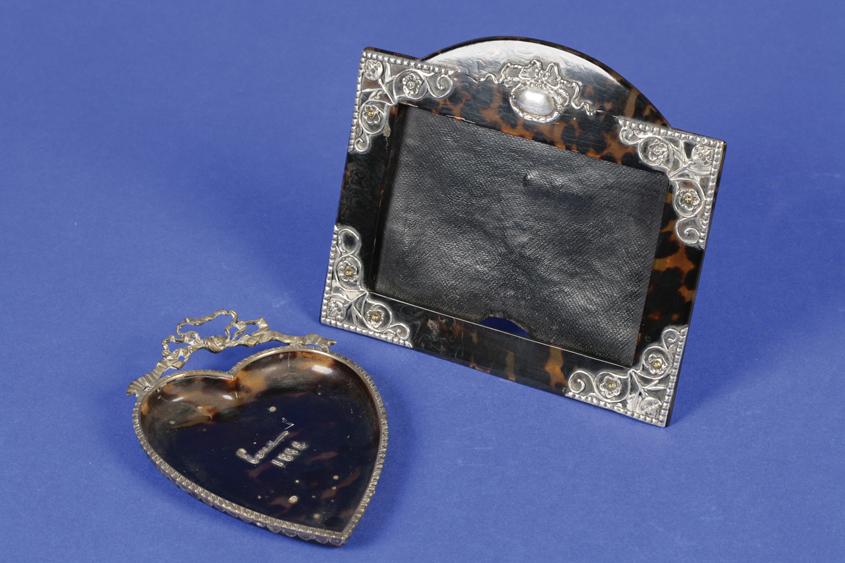 Appraisal: A VICTORIAN SILVER MOUNTED TORTOISESHELL PHOTOGRAPH FRAME of shaped rectangular