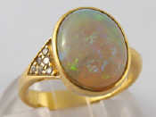 Appraisal: A yellow metal tests carat gold opal and diamond ring