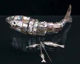 Appraisal: An articulated model of a fish in mother-of-pearl with brass