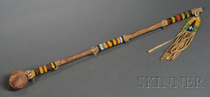 Appraisal: Plains Beaded Hide Stone and Wood Skullcracker c handle wrapped