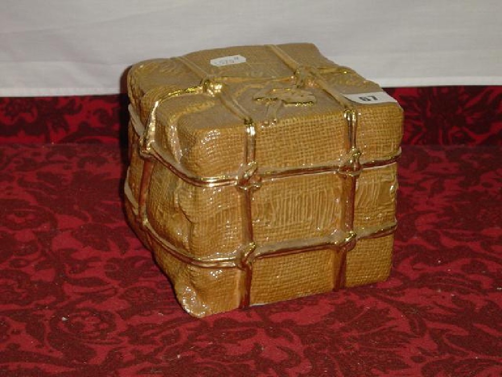 Appraisal: A box and cover in the form of a parcel