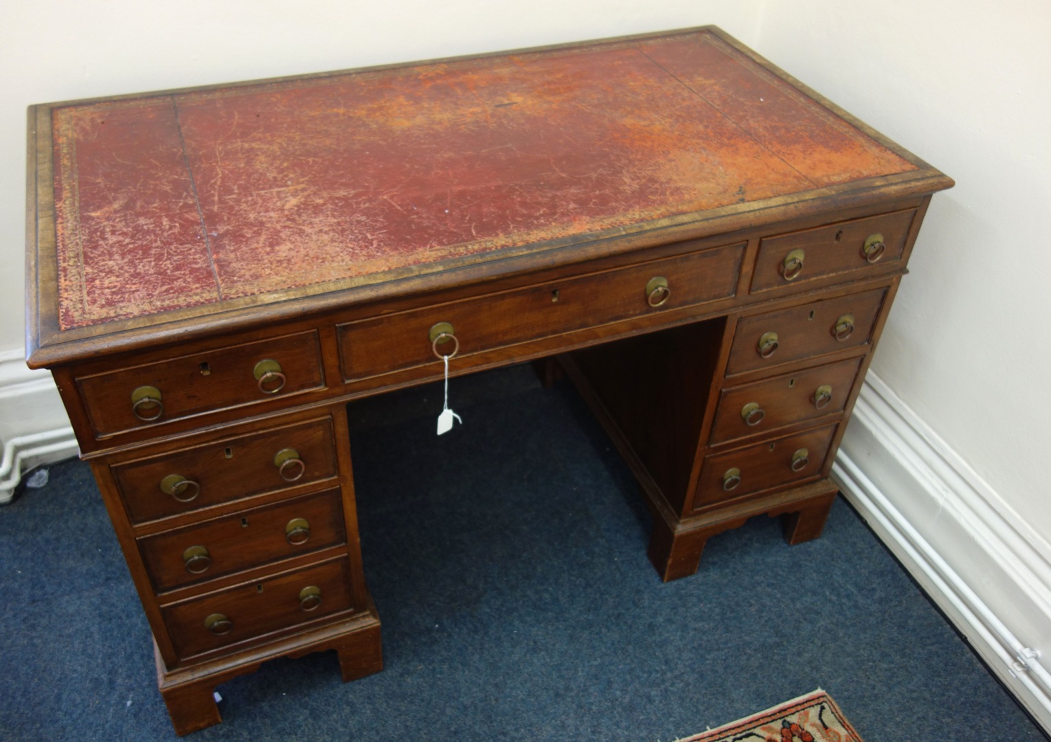 Appraisal: A George III style mahogany kneehole desk early th century