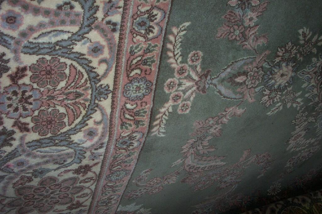 Appraisal: A substantial pale green ground wool carpet with floral decoration