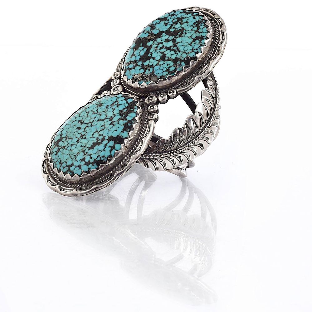 Appraisal: NAVAJO TURQUOISE AND SILVER DOUBLE STONE CUFF Tooled leaves double