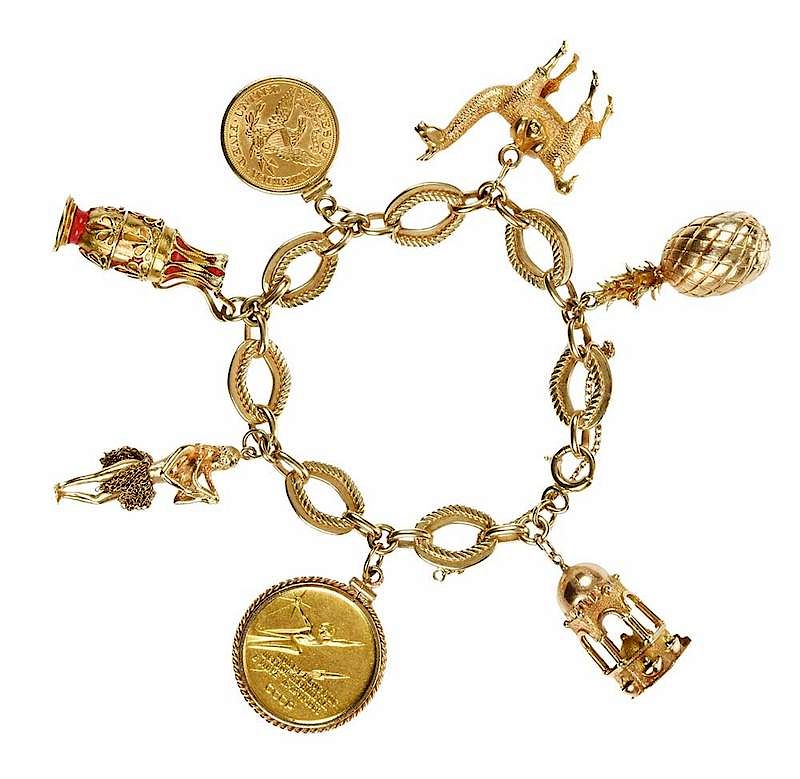 Appraisal: Gold Charm Bracelet five kt charms including coin pineapple urn