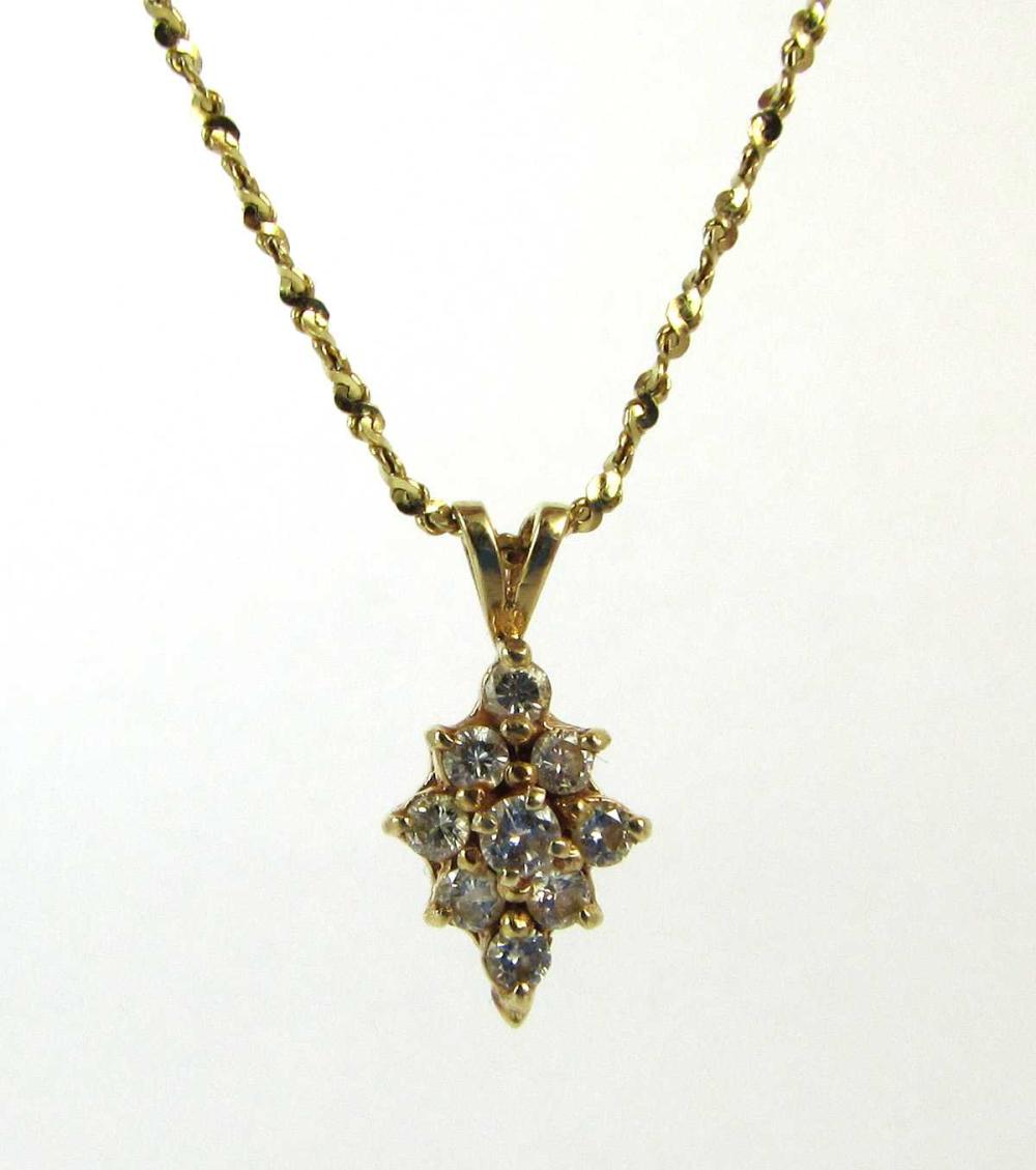 Appraisal: DIAMOND AND FOURTEEN KARAT GOLD PENDANT NECKLACE with a -