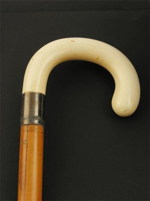 Appraisal: An ivory handled 'Shepherd's crook' walking cane with a silver