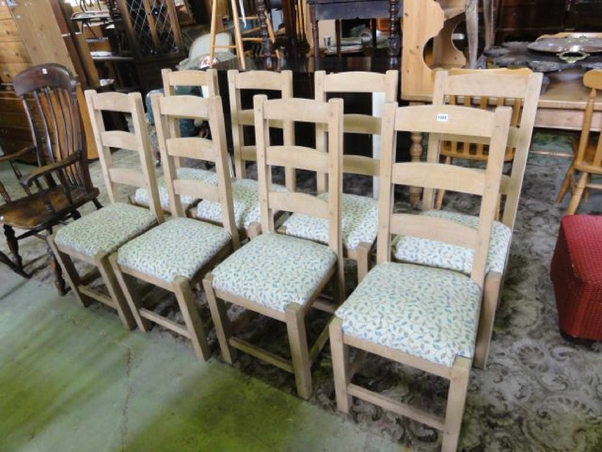 Appraisal: A set of eight beechwood ladder back dining chairs with