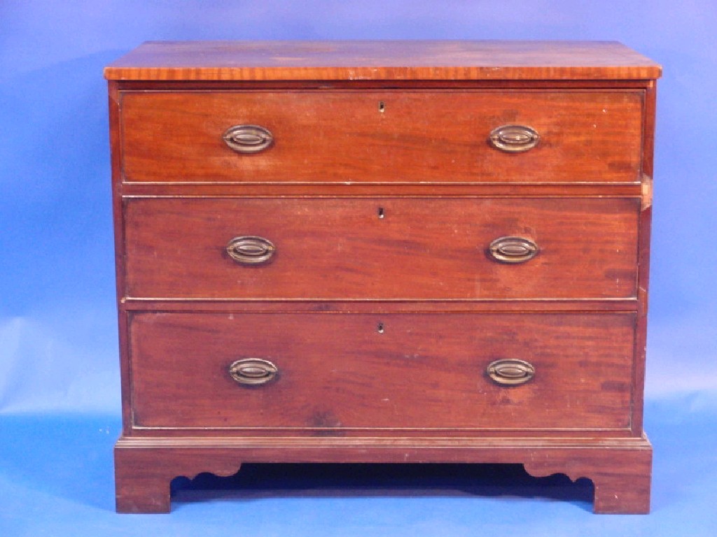 Appraisal: A George III mahogany chest of three long drawers with