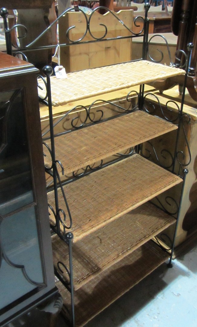 Appraisal: A wrought iron five tier floor standing shelf together with