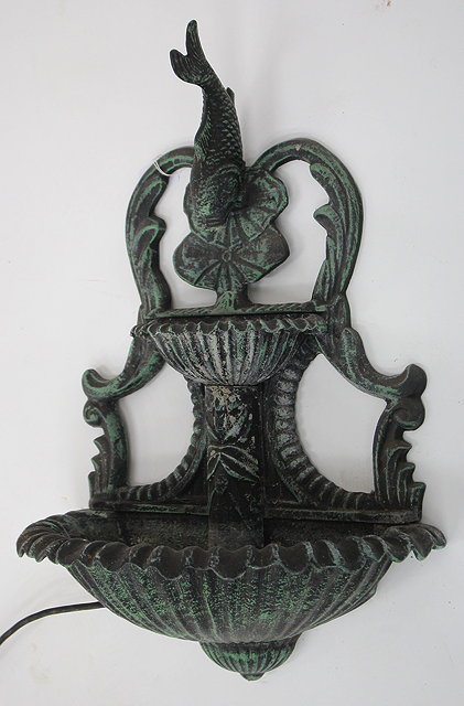 Appraisal: A BRONZED CAST METAL TWO TIER WALL FOUNTAIN surmounted by