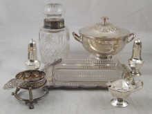 Appraisal: A hallmarked silver tea strainer stand and plated strainer also