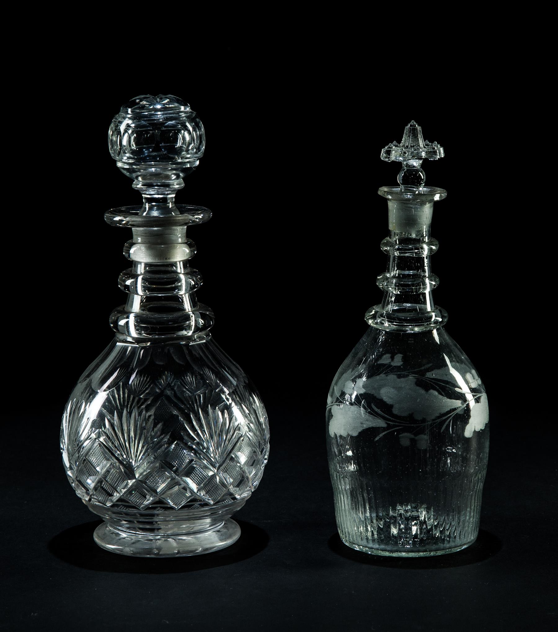 Appraisal: TWO CLEAR BLOWN FLINT GLASS THREE-RING DECANTERS American nd quarter-