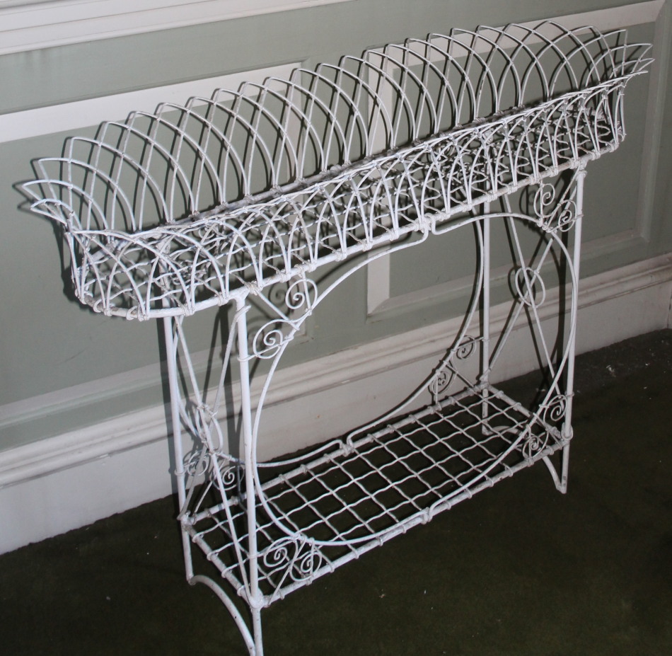 Appraisal: A thC style wirework rectangular jardiniere with shaped sides and