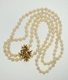 Appraisal: k yellow gold pearl and diamond double strand necklace k