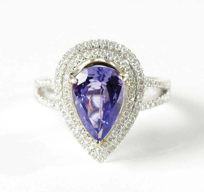 Appraisal: TANZANITE DIAMOND AND FOURTEEN KARAT WHITE GOLD RING with round-cut