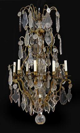 Appraisal: LOUIS XV-STYLE CUT-GLASS-MOUNTED GILT-METAL EIGHT-LIGHT CHANDELIER The pear-form skeletal frame