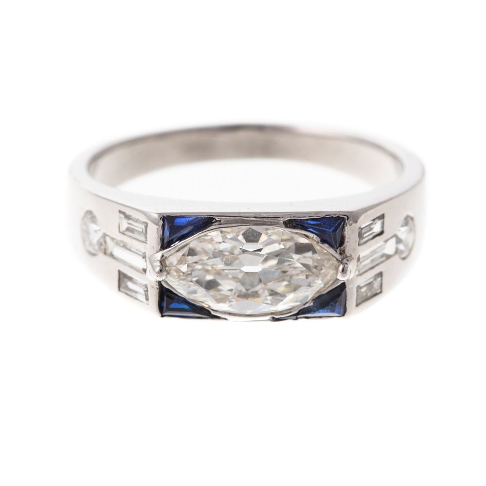 Appraisal: A Marquise Diamond Sapphire Ring in Platinum Platinum ring featuring