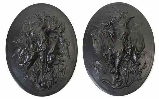 Appraisal: A Pair of Cast Iron Plaques each of oval form