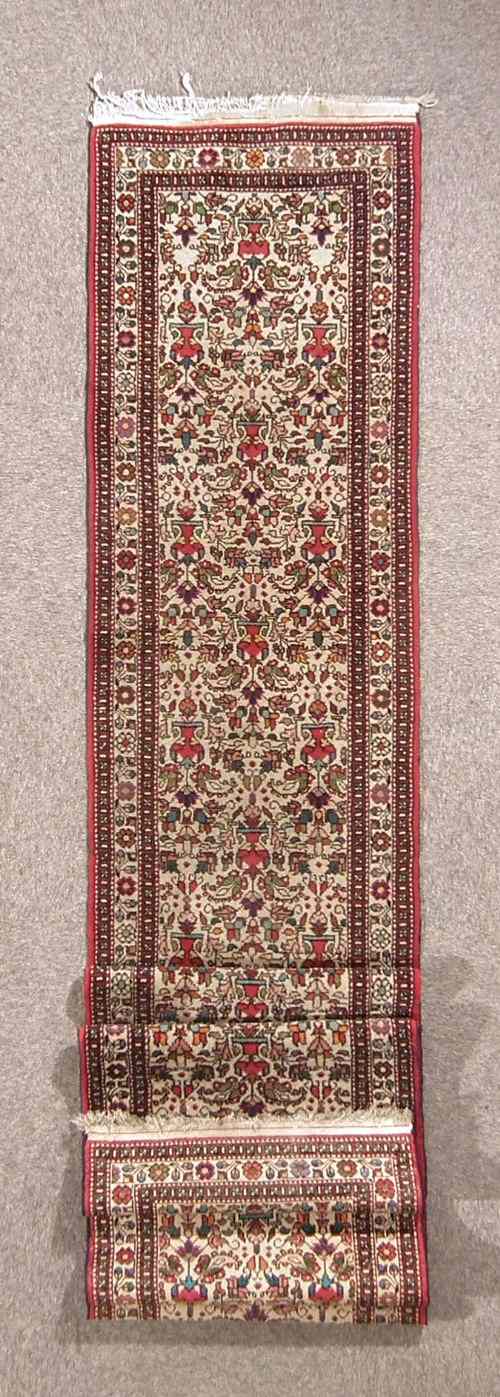 Appraisal: A Hamadan runner woven in colours with endless Herati variations