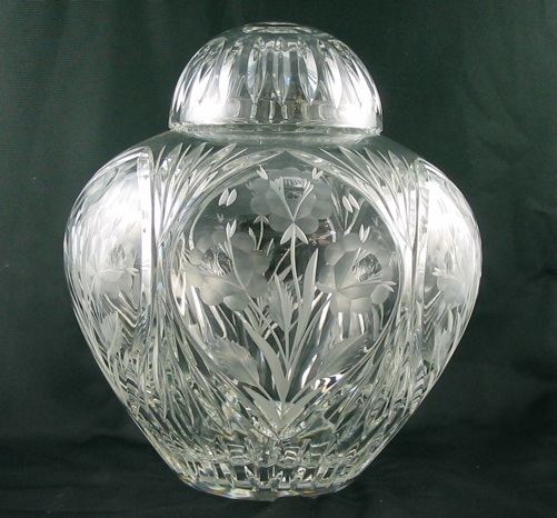 Appraisal: A CUT CRYSTAL COVERED VASE engraved and cut floral design