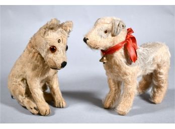 Appraisal: Two vintage glass eyed stuffed dogs Steiff seated dog with