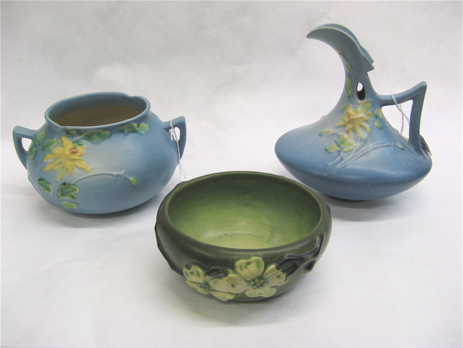 Appraisal: THREE AMERICAN ROSEVILLE ART POTTERY PIECES The green Dogwood pattern