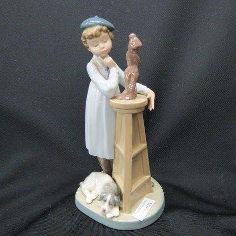 Appraisal: Lladro Porcelain Figurine of Young Sculptureat work dog at his