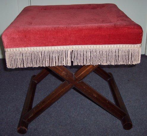 Appraisal: A stool with upholstered top on an X frame support