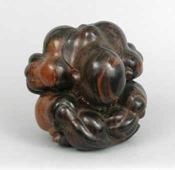 Appraisal: A Carved Wood Bending Yogi Sculpture A carved wood bending