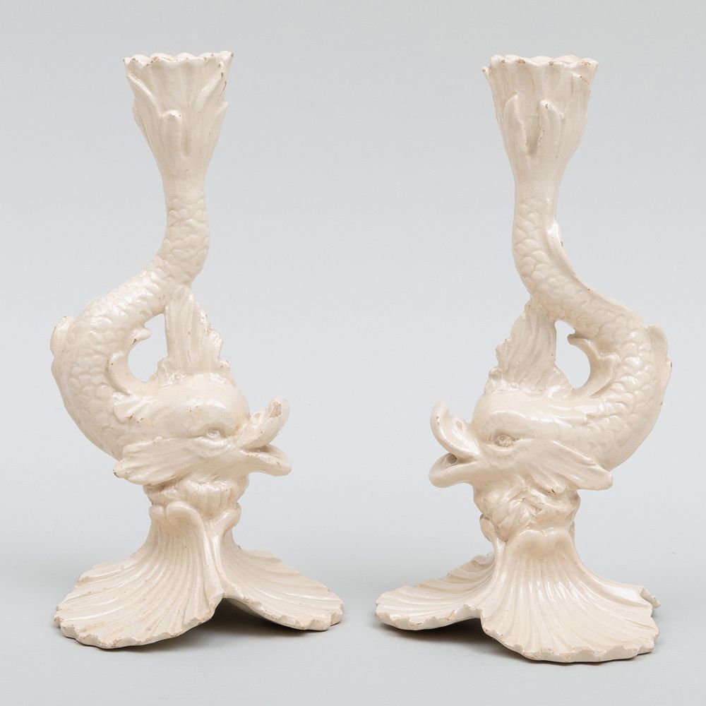 Appraisal: Pair of English Creamware Dolphin Form Candlesticks Impressed ' '