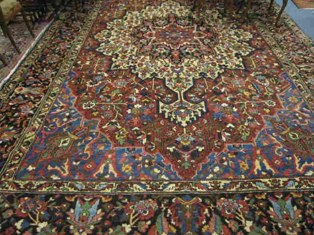 Appraisal: Heriz Persian Handmade Room Size Rug stunning central medallion deep