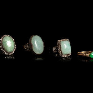 Appraisal: Four Chinese Jadeite Inset Metal Rings two with oval shaped