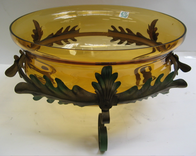 Appraisal: AMBER GLASS CENTERPIECE BOWL fitted in a painted green and